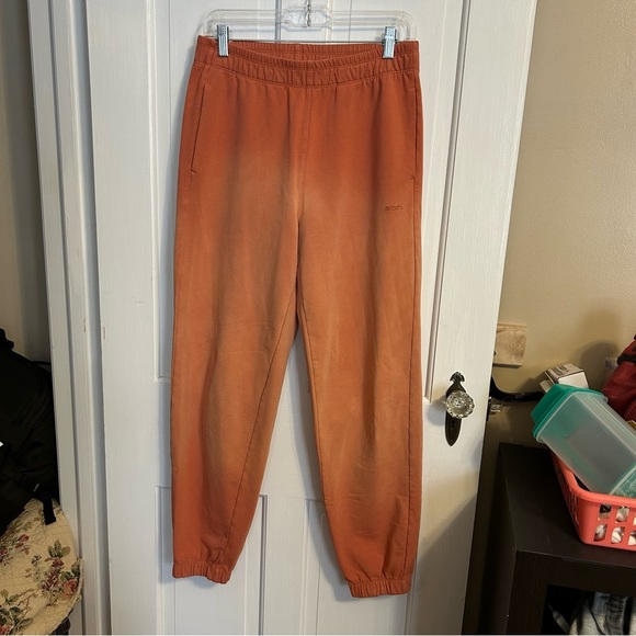 Stori by Katy Hearn Backstory Sweatpants in Sunfade Sandstone Orange 6 - Picture 1 of 6